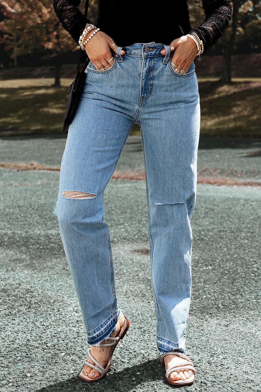 a woman in a black shirt and jeans