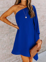 a woman wearing a blue one shoulder dress