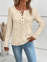 a woman wearing a white sweater and jeans