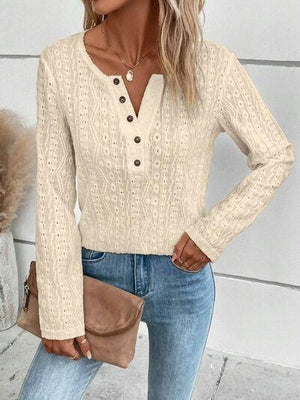 a woman wearing a white sweater and jeans