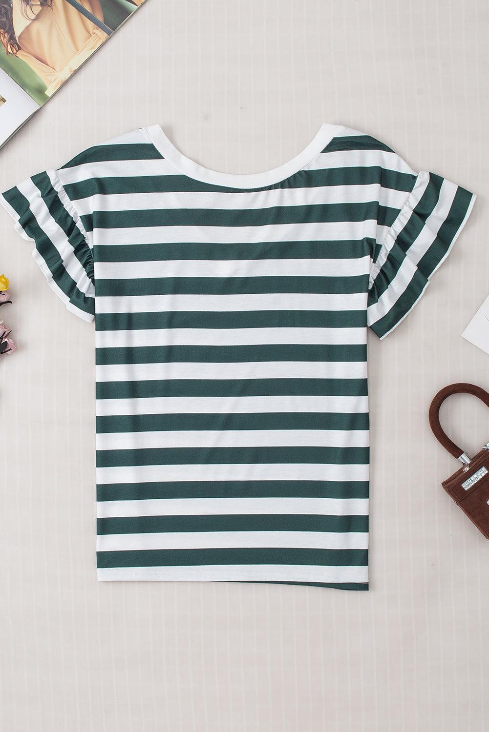a green and white striped shirt next to a pair of scissors