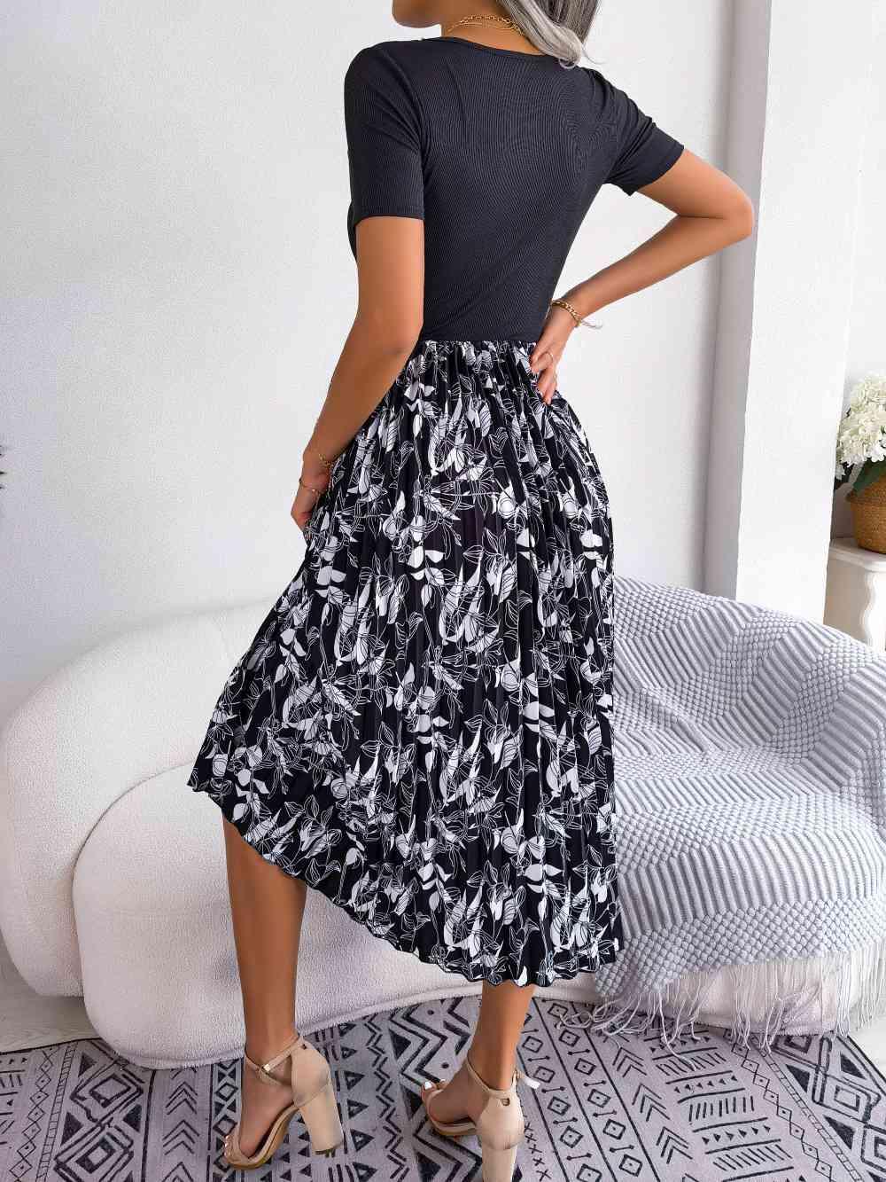 a woman wearing a black and white skirt