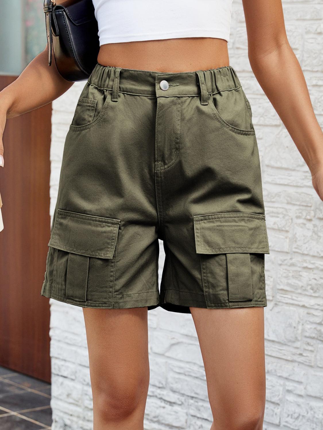 a close up of a person wearing green shorts