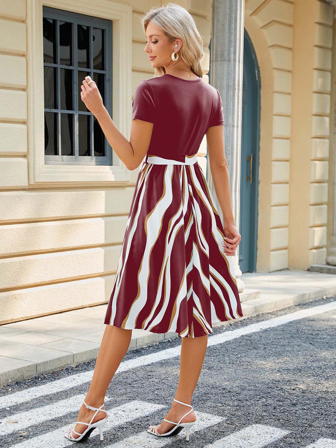 a woman in a red and white striped dress