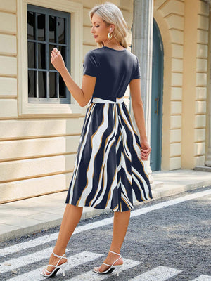 a woman in a dress is standing on the street