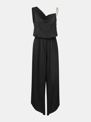 a black jumpsuit with an asymmetrical neckline