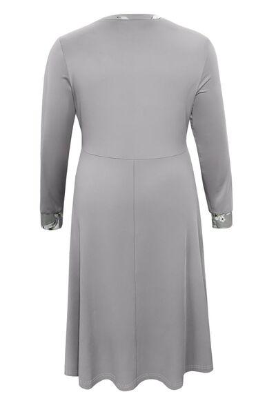 a women's grey dress with long sleeves