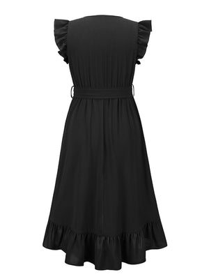 a black dress with ruffles on the shoulders