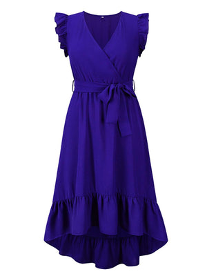 a woman wearing a purple dress with ruffles