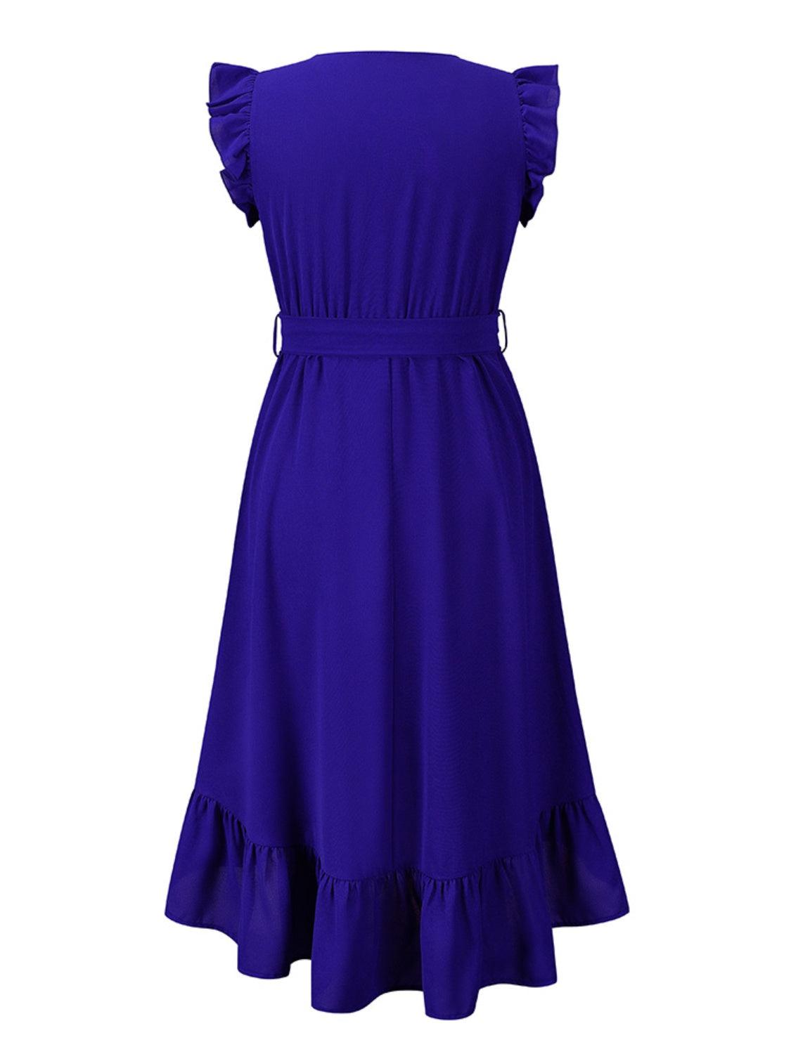 a purple dress with ruffles on the shoulders