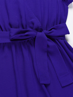 a close up of a purple dress with a tie