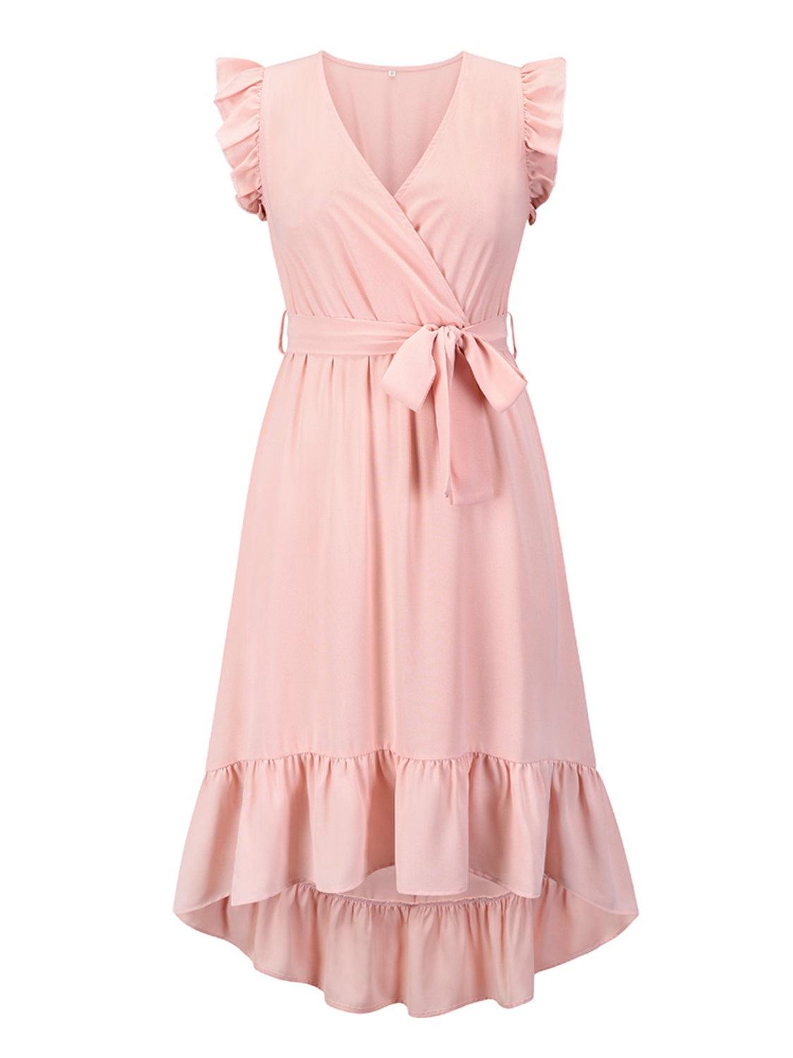 a pink dress with a bow on the waist