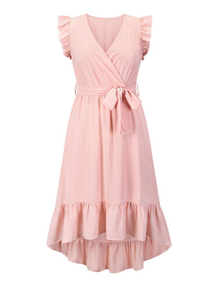 a pink dress with a bow on the waist