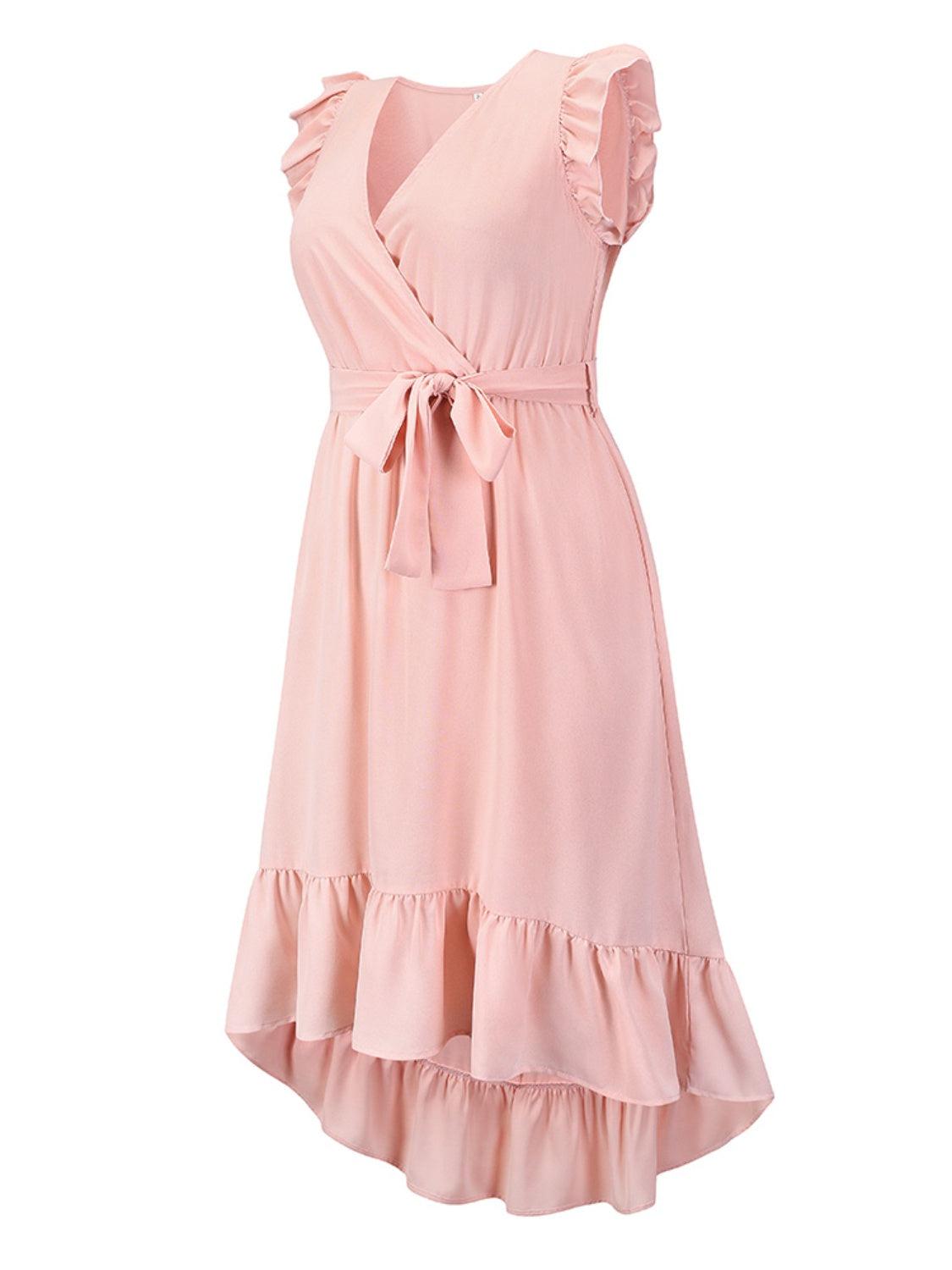 a pink dress with ruffles on it