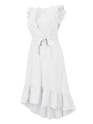 a woman wearing a white dress with ruffles