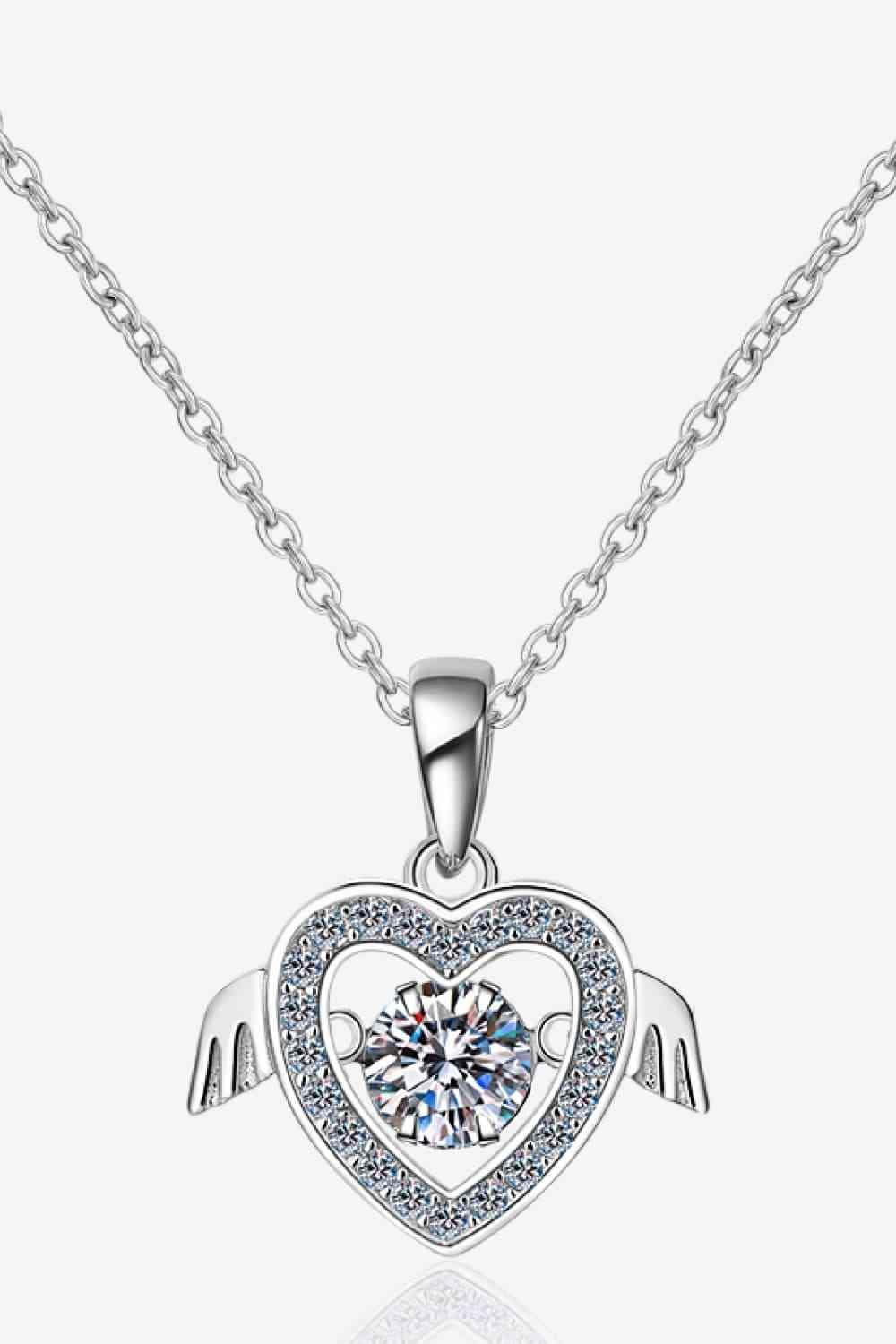 a necklace with a heart and wings on it