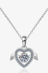 a necklace with a heart and wings on it