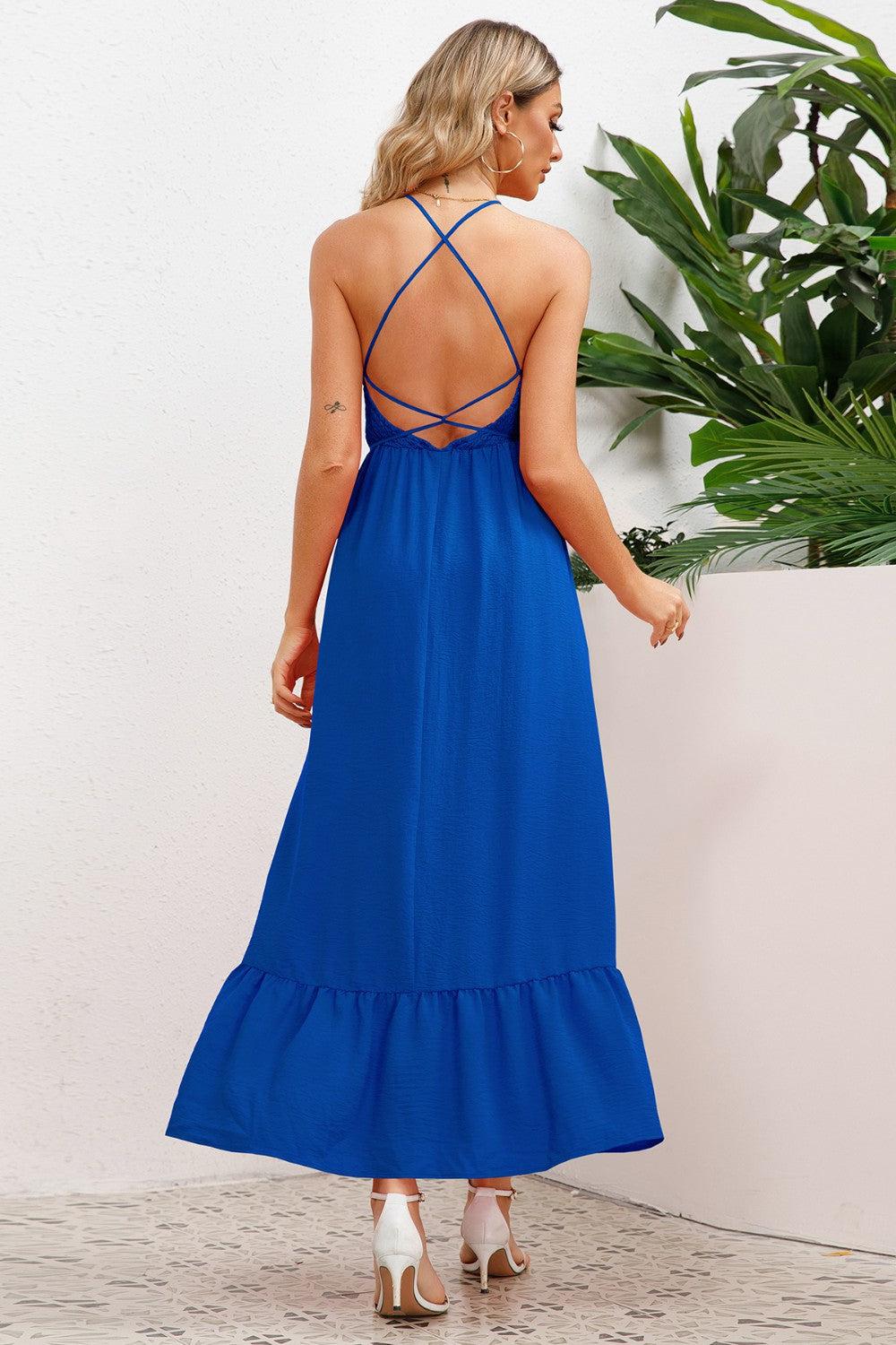 the back of a woman wearing a blue dress