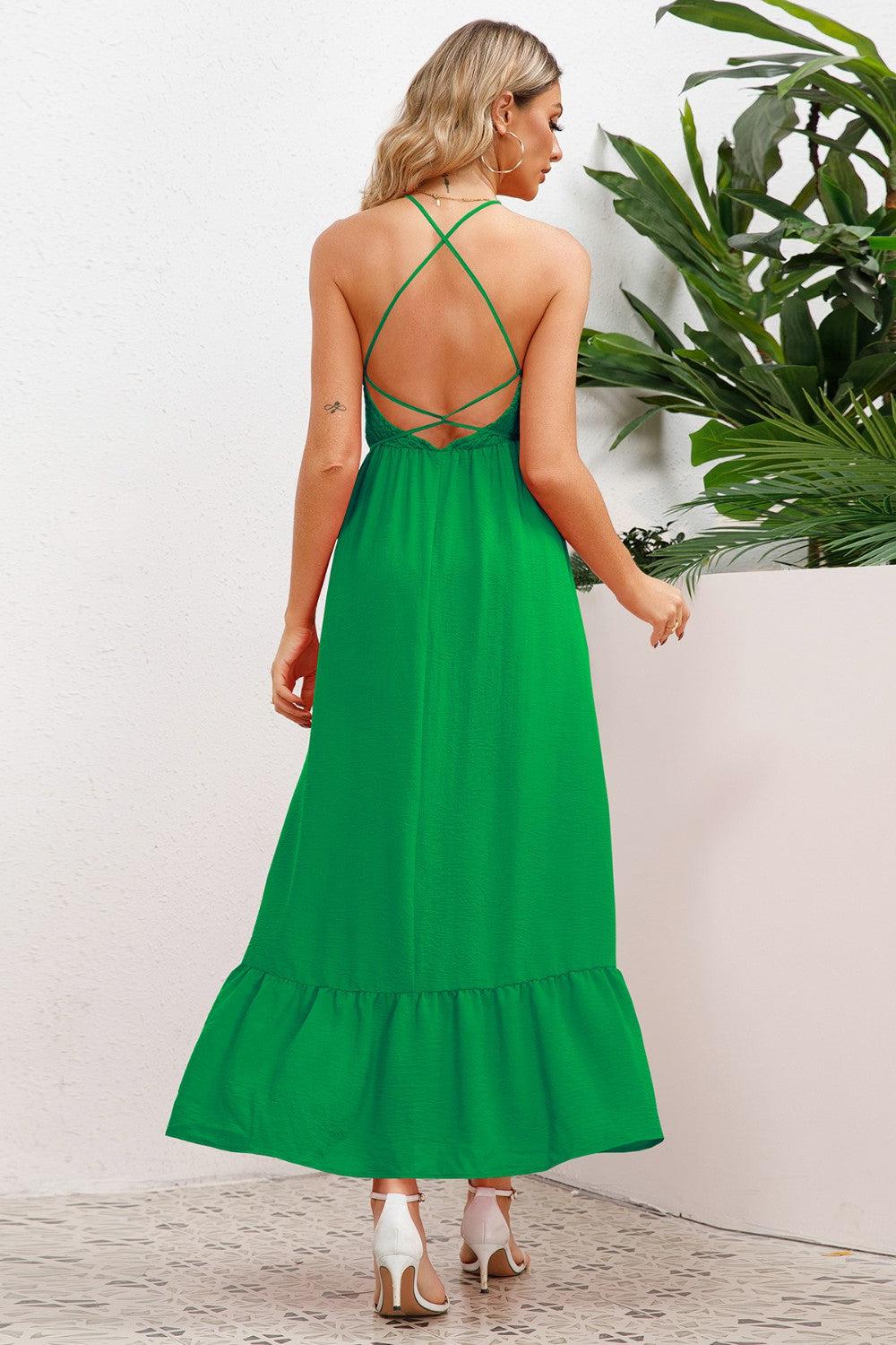 the back of a woman wearing a green dress