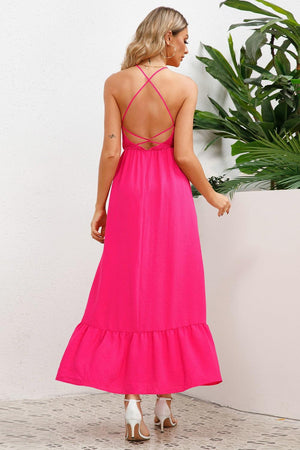 the back of a woman wearing a bright pink dress