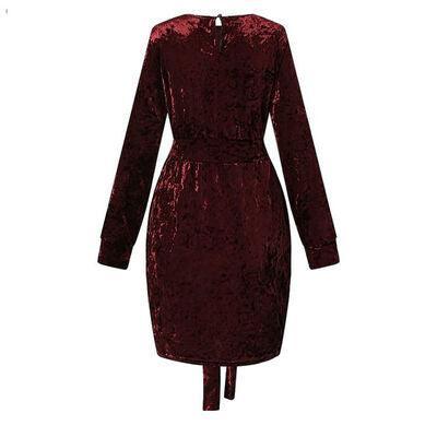 a red velvet dress with long sleeves