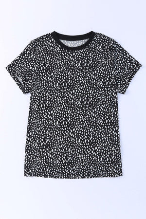 a black and white t - shirt with white spots on it