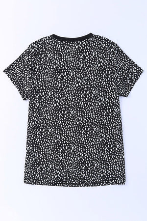a black and white t - shirt on a white background