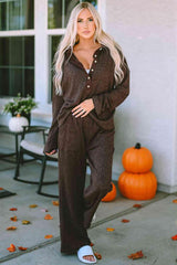 a woman standing on a porch wearing a brown jumpsuit