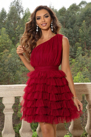 a woman in a red dress posing for a picture