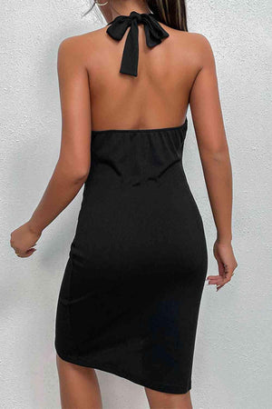 the back of a woman wearing a black dress