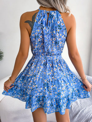 a woman wearing a blue dress with flowers on it