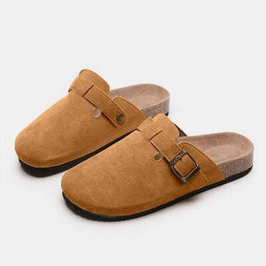 a pair of brown slippers on a white background