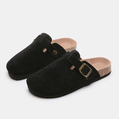 a pair of black slippers with buckles
