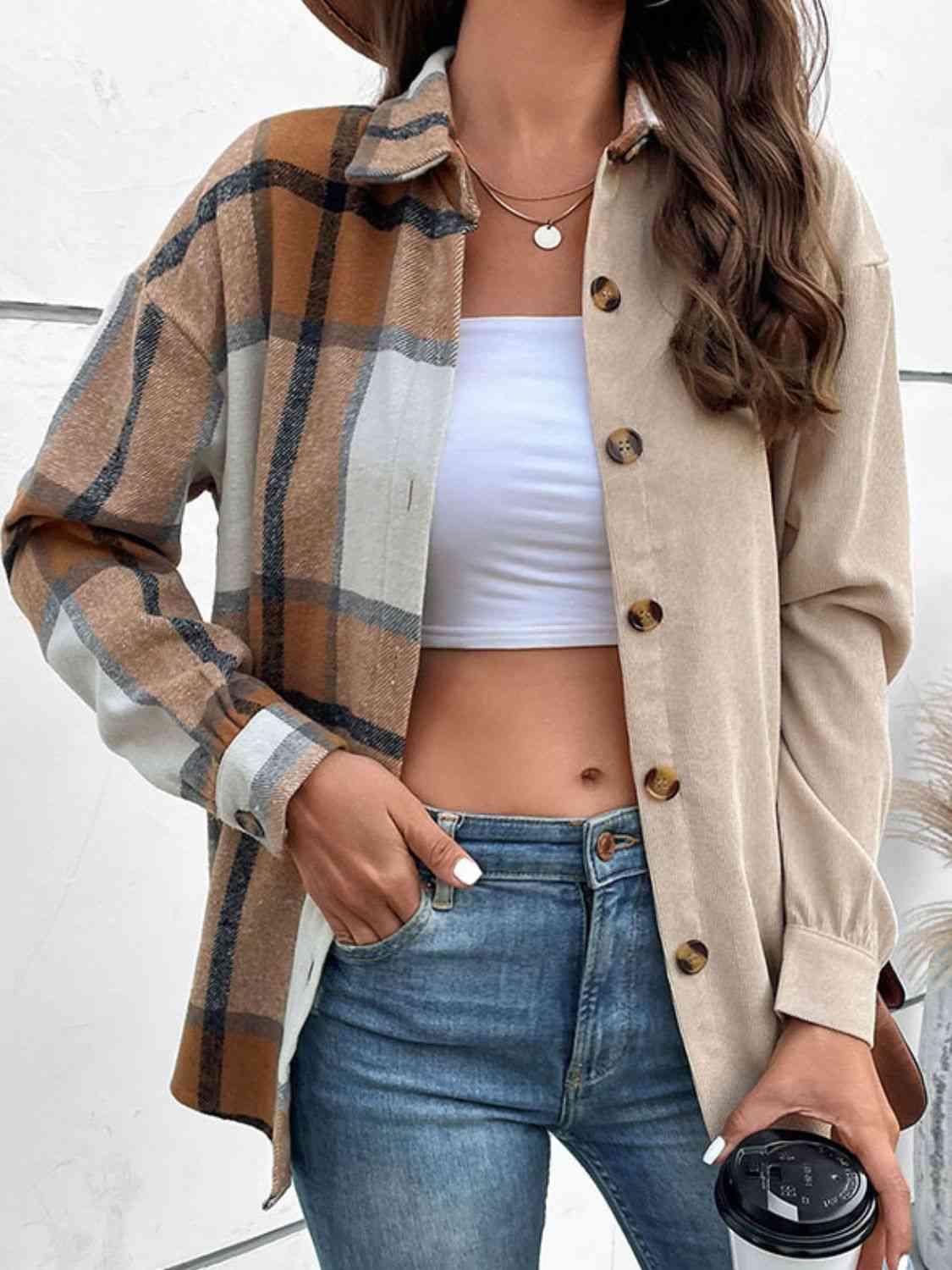 a woman wearing a tan jacket and jeans