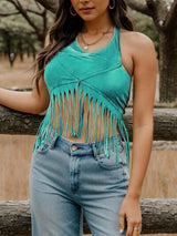 a woman standing next to a wooden fence