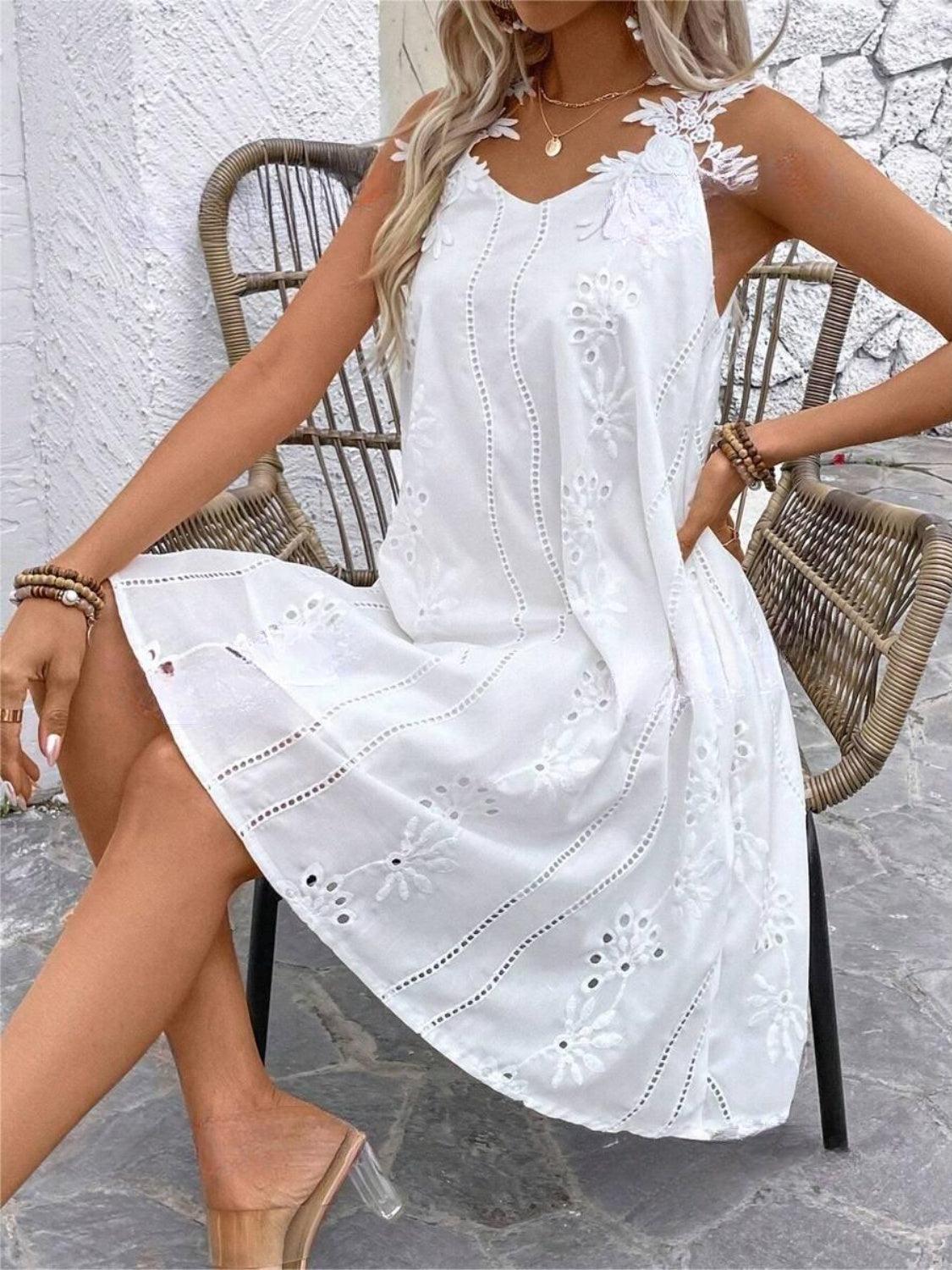 a woman sitting on a chair wearing a white dress