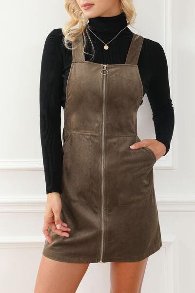 a woman wearing a brown leather dress
