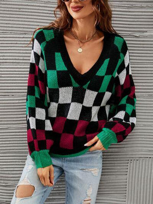 a woman wearing a green and black checkered sweater