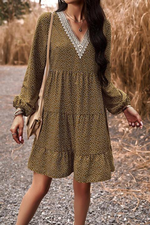 a woman in a dress walking down a road