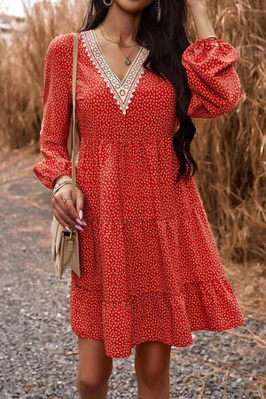 a woman in a red polka dot dress