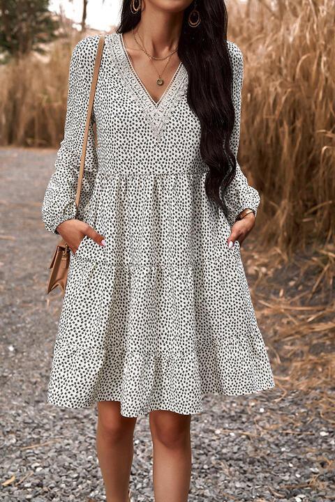 a woman standing on a gravel road wearing a white dress