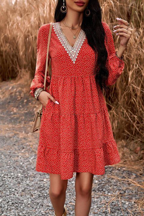 a woman in a red dress smoking a cigarette