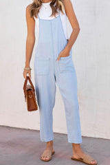 a woman in overalls and a white shirt