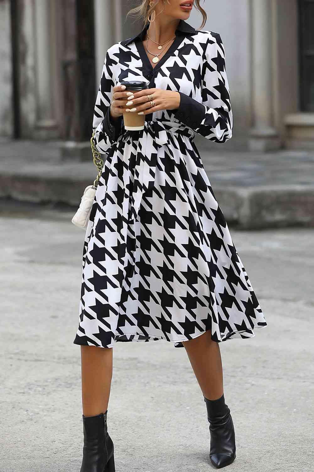 a woman in a black and white checkered dress