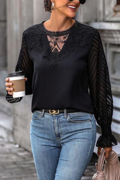 a woman walking down a street holding a cup of coffee