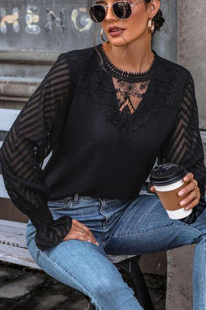 a woman sitting on a bench with a cup of coffee