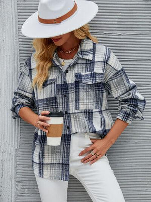 a woman wearing a white hat and a plaid shirt
