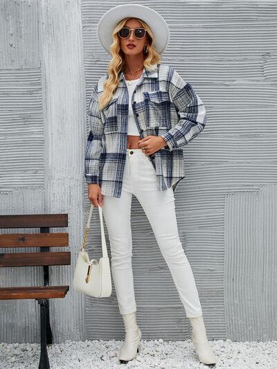 a woman wearing white pants and a plaid shirt
