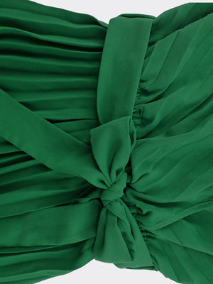 a close up of a green dress with a tie