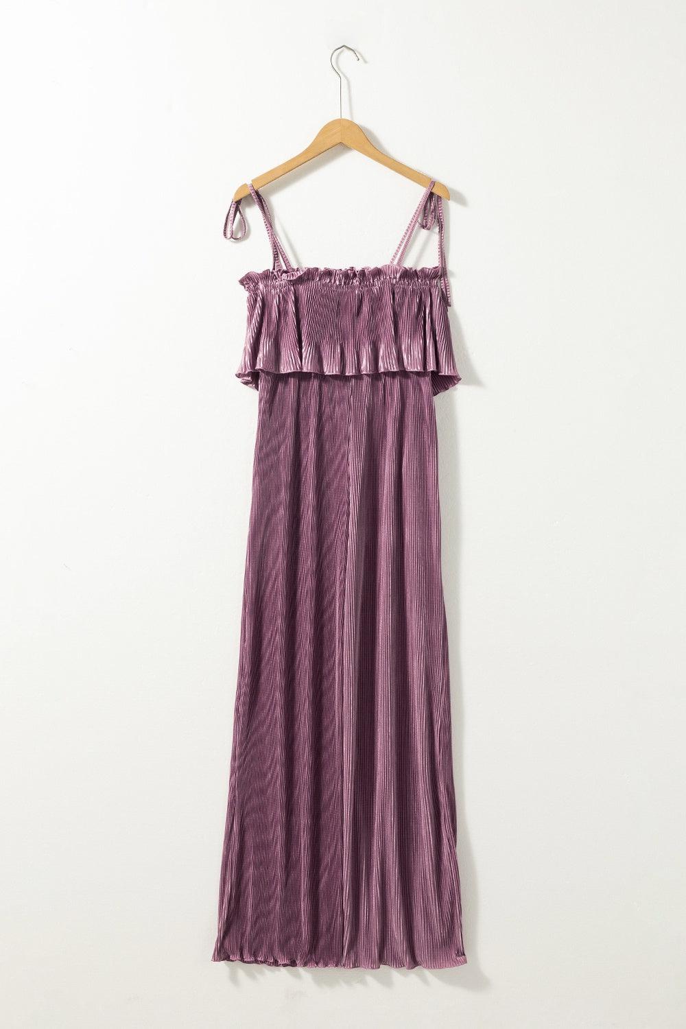 a purple dress hanging on a hanger